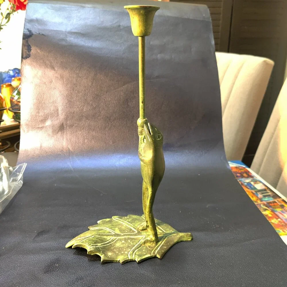 Brass Frog Sculpture holding a candlestick while floating on a lilypad 11